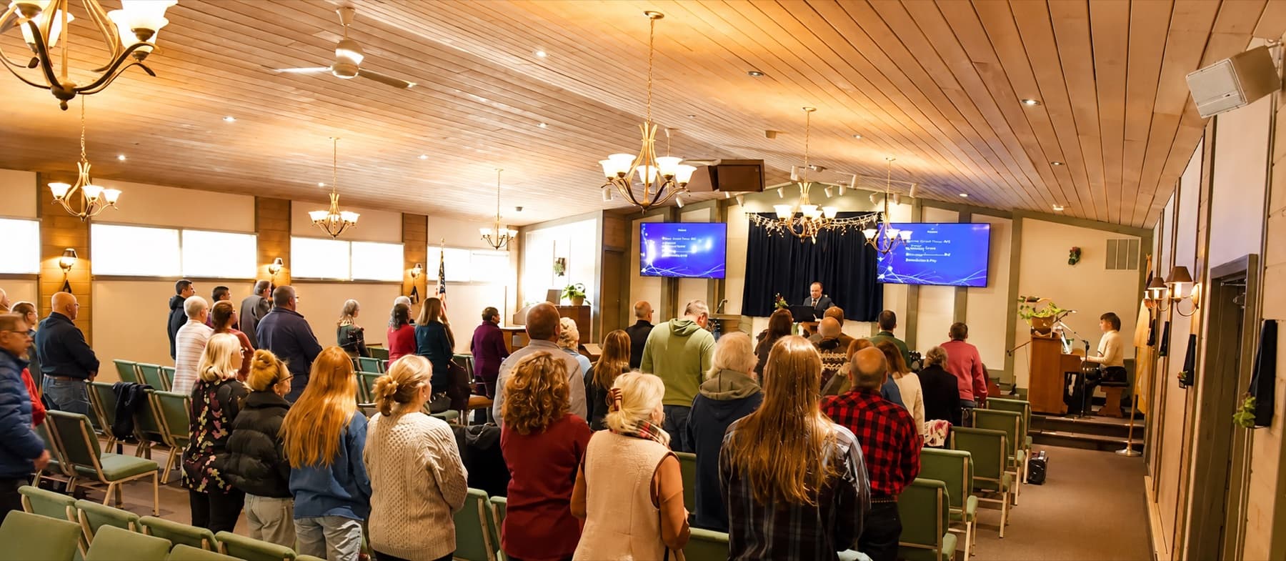 The congregation standing to sing on a Sunday morning at Independent Baptist Church